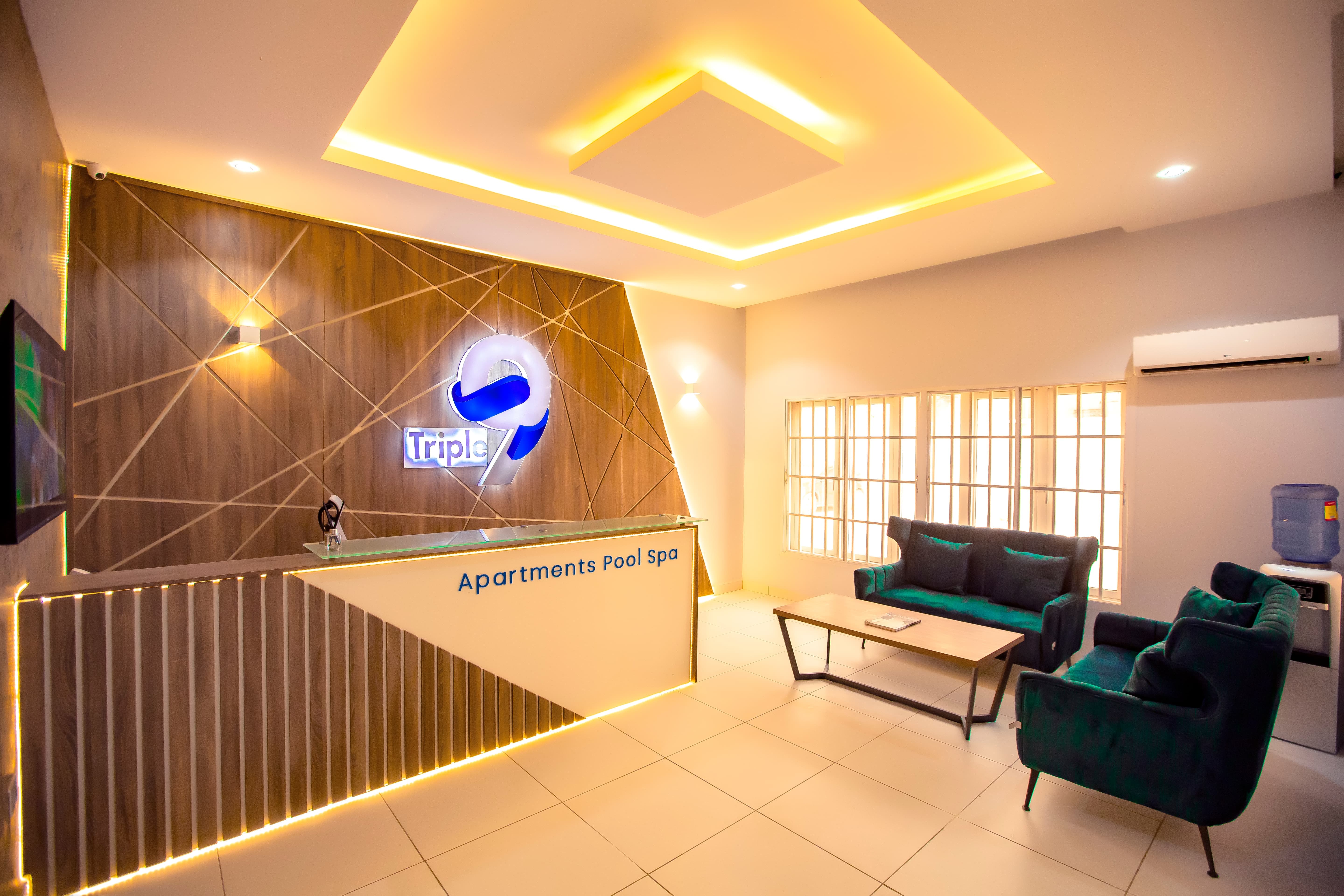 Triple 9 Apartments exterior illuminated at night