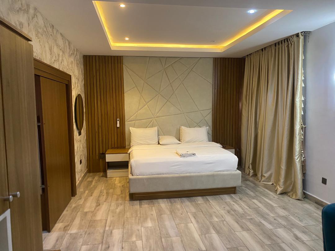 Spacious Presidential Suite bedroom with elegant furnishings and modern decor